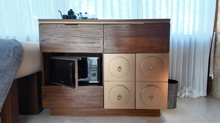 The refreshment corner unit at The Mahaloka showing the microwave with its door open.